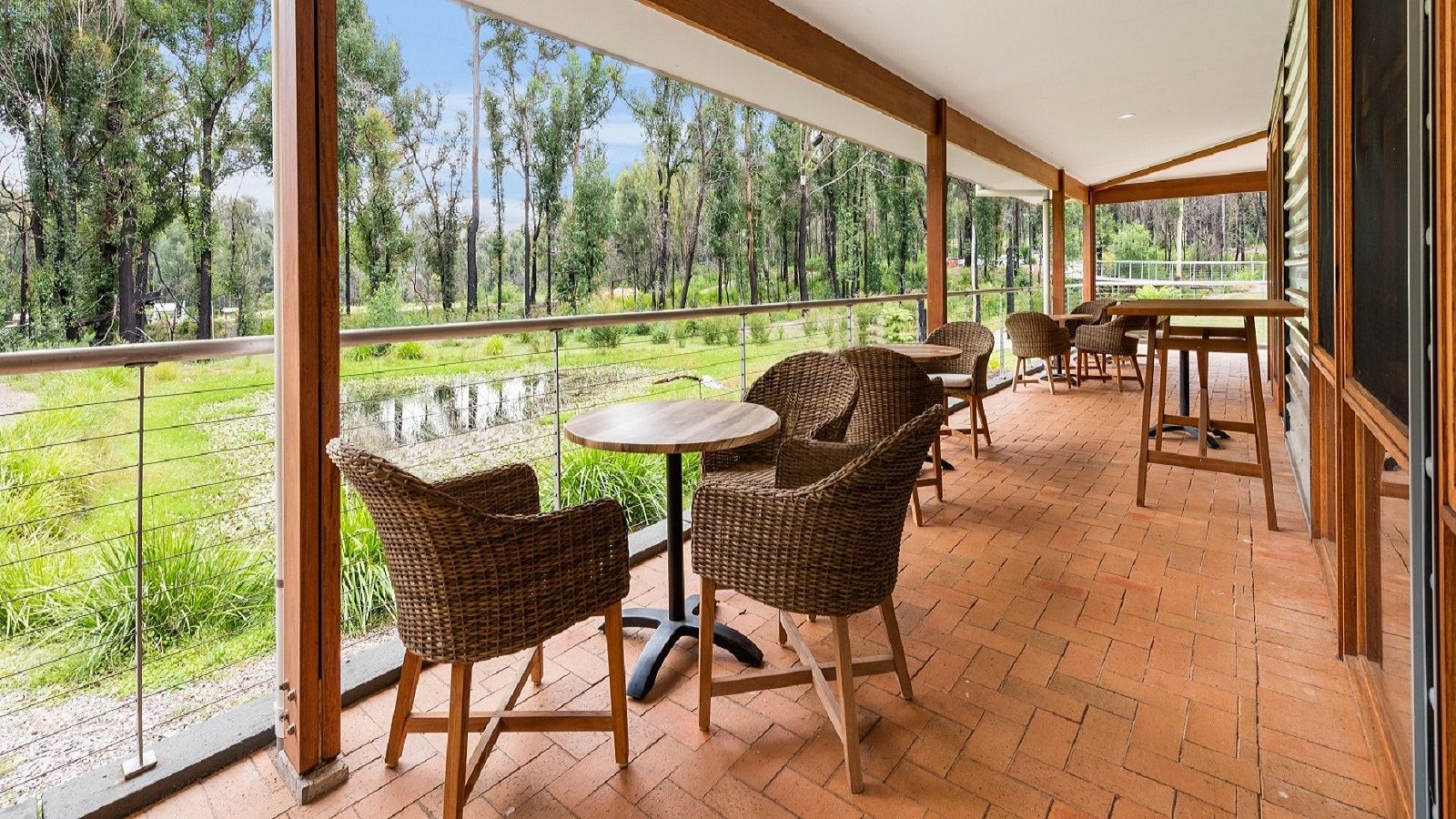 Outdoor terrace seating at the Eurobodalla Botanic Garden cafe. banner image