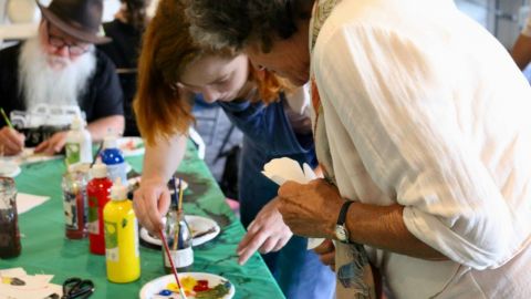 Painting activity with child and adults